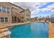 Inviting pool and patio with comfortable seating and lush landscaping at 5540 Wood Falls Dr, Buford, GA 30518