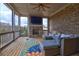 Relaxing screened porch with cozy seating, a fireplace, and outdoor views at 5540 Wood Falls Dr, Buford, GA 30518