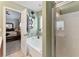 Bathroom featuring a separate tub and shower, modern decor, and a glimpse into the main bedroom at , Conyers, GA 30012