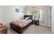 Cozy bedroom featuring a wooden bed frame, natural light from the window, and neutral wall color at , Conyers, GA 30012