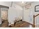 Inviting entryway with hardwood floors, a welcome sign, and easy access to a half bath at , Conyers, GA 30012