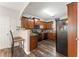 Cozy kitchen with sleek black appliances and warm wood cabinetry at , Conyers, GA 30012