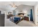 Spacious main bedroom featuring a ceiling fan, carpeted floors, and ample natural light from two windows at , Conyers, GA 30012