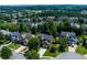 An aerial view of a suburban neighborhood with tree lined streets at 213 Roseman Way, Woodstock, GA 30188