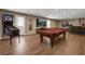 A basement entertainment area with a pool table and a pinball machine at 213 Roseman Way, Woodstock, GA 30188