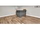 The Basement showcases a wooden bar area, perfect for entertaining guests at 213 Roseman Way, Woodstock, GA 30188