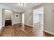 Finished basement with wood floors, staircase, and open floorplan at 213 Roseman Way, Woodstock, GA 30188