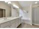 Bright bathroom featuring a double vanity, soaking tub, separate shower and tile flooring at 213 Roseman Way, Woodstock, GA 30188