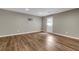 An interior view of a bedroom with hardwood floors and a white door at 213 Roseman Way, Woodstock, GA 30188