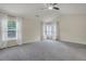 Bedroom with neutral carpet, many windows, and high vaulted ceiling at 213 Roseman Way, Woodstock, GA 30188