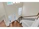 Open foyer showcasing hardwood floors, a staircase, and a view of the entrance at 213 Roseman Way, Woodstock, GA 30188