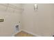 Utility room features tile floor, a wall-mounted ironing board, and laundry connections at 213 Roseman Way, Woodstock, GA 30188