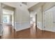 Spacious living room featuring hardwood floors, wainscoting, and ample natural light at 213 Roseman Way, Woodstock, GA 30188