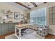 Cozy home office with custom built-ins, a large window, and ample natural light at 213 Roseman Way, Woodstock, GA 30188