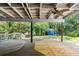 Inviting back deck with ceiling fan, bar area, and view of spacious backyard with storage shed at 3617 Lassiter Rd, Marietta, GA 30062
