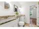 Elegant bathroom with double sinks, granite countertops, and modern lighting at 3617 Lassiter Rd, Marietta, GA 30062