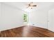 Bedroom featuring hardwood floors, natural light, and a closet at 3617 Lassiter Rd, Marietta, GA 30062
