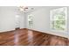 Spacious bedroom with hardwood floors, ceiling fan and natural light from two windows at 3617 Lassiter Rd, Marietta, GA 30062