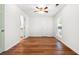 Bedroom with hardwood flooring and ceiling fan; doorway into a bathroom visible at 3617 Lassiter Rd, Marietta, GA 30062