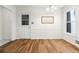 Dining room featuring hardwood floors, natural light, and modern chandelier at 3617 Lassiter Rd, Marietta, GA 30062
