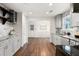 Open kitchen design with stainless appliances, tiled backsplash, and granite countertops at 3617 Lassiter Rd, Marietta, GA 30062