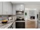 Bright kitchen with stainless steel appliances and granite countertops at 3617 Lassiter Rd, Marietta, GA 30062