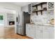 Spacious kitchen featuring stainless steel refrigerator, granite countertops, and tiled backsplash at 3617 Lassiter Rd, Marietta, GA 30062