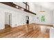 Bright living room features hardwood floors, beam accent, and open layout at 3617 Lassiter Rd, Marietta, GA 30062
