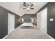 Bedroom with gray walls, a ceiling fan, a bed, and two doorways at 3793 Market Cres, Clarkston, GA 30021