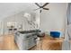 Spacious living room with vaulted ceilings, hardwood floors, and a modern sectional sofa, ideal for Gathering gatherings at 3793 Market Cres, Clarkston, GA 30021