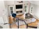 Open concept living room with hardwood floors, fireplace, large windows, and stylish modern furnishings at 3793 Market Cres, Clarkston, GA 30021