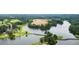 Beautiful aerial view of a golf course community with homesites, a lake, and lush greenery at 915 Sundown Pt, Villa Rica, GA 30180