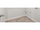 The laundry room features vinyl tile floors and a utility connection for washer and dryer at 915 Sundown Pt, Villa Rica, GA 30180