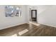 Bright and airy living room featuring sleek hardwood floors and a view of the home's exterior at 915 Sundown Pt, Villa Rica, GA 30180