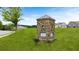 Landscaped community signage at Fairway at Champion Woods with well-manicured lawns and new construction homes at 915 Sundown Pt, Villa Rica, GA 30180