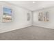 Bright bedroom with large windows, plush carpet and neutral paint at 917 Sundown Pt, Villa Rica, GA 30180