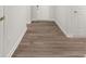 Hallway featuring attractive hardwood flooring, creating a cohesive and stylish look at 917 Sundown Pt, Villa Rica, GA 30180