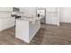 Stylish kitchen featuring granite counters, an island, and stainless steel appliances at 917 Sundown Pt, Villa Rica, GA 30180