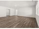 Spacious and bright living room with hardwood floors, offering an inviting and flexible area at 917 Sundown Pt, Villa Rica, GA 30180