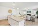 Open floor plan featuring the kitchen island and a living room with a fireplace at 2018 Wyndham Pl, Conyers, GA 30013