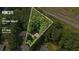 Aerial view showing home's location on 0.71 acres and proximity to wooded area at 202 Cedar Valley Ct, Canton, GA 30115
