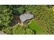 Overhead aerial view highlighting home on a large lot with a green lawn surrounded by mature trees at 202 Cedar Valley Ct, Canton, GA 30115