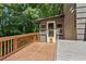This back deck features wood railing, a privacy fence, and easy access to the home at 202 Cedar Valley Ct, Canton, GA 30115