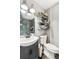 This bathroom features a modern vanity, toilet, and decorative shelving that adds personality at 202 Cedar Valley Ct, Canton, GA 30115