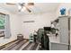 This bedroom has a ceiling fan, wood-look flooring, and a window to provide natural light at 202 Cedar Valley Ct, Canton, GA 30115