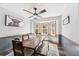 Cozy dining room with bay windows, wood floors, and a rustic table and bench, ideal for Gathering meals at 202 Cedar Valley Ct, Canton, GA 30115
