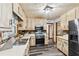 Efficient kitchen featuring stainless steel appliances, painted cabinets, and durable flooring for a clean and modern look at 202 Cedar Valley Ct, Canton, GA 30115