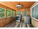 This laundry room features a wood ceiling and walls, new washer and dryer, and lots of natural light at 202 Cedar Valley Ct, Canton, GA 30115