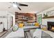 Stylish living room with a cozy fireplace, wood accent wall, and comfortable seating arrangement for a relaxing ambiance at 202 Cedar Valley Ct, Canton, GA 30115