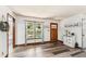 Bright, open living room featuring wood-look flooring, a large window, and tasteful decor for a welcoming atmosphere at 202 Cedar Valley Ct, Canton, GA 30115